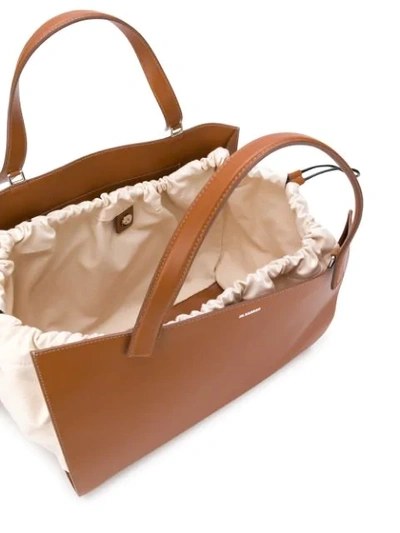 Shop Jil Sander Drawstring Tote Bag In Brown