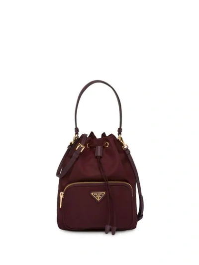 Shop Prada Logo Plaque Bucket Bag In Red