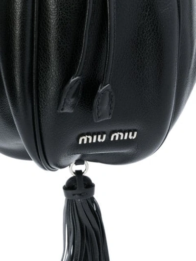 Shop Miu Miu Tassel Embellished Bucket Bag In Black