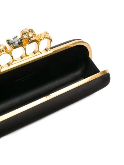 Shop Alexander Mcqueen Four Ring Skull Clutch Bag In Black