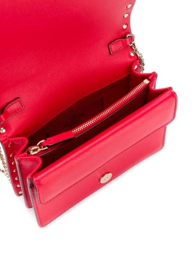 Shop Valentino Rockstud Shoulder Pouch In Red