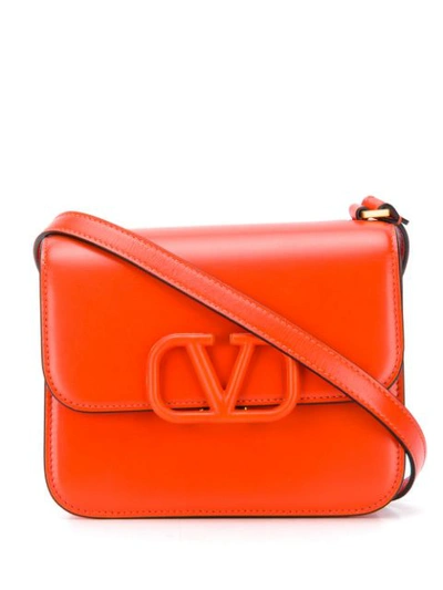 Shop Valentino Garavani Logo Plaque Crossbody Bag In Lb8 Goldfish