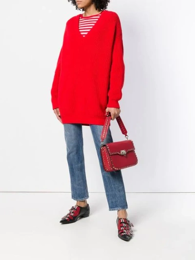 Shop Valentino Rockstud Messenger Bag In Red