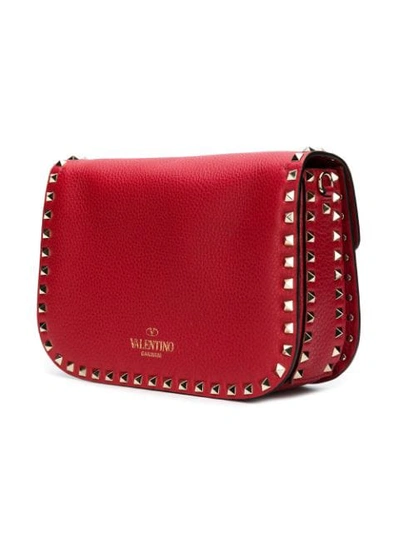 Shop Valentino Rockstud Messenger Bag In Red