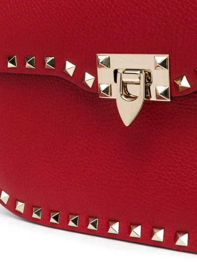 Shop Valentino Rockstud Messenger Bag In Red