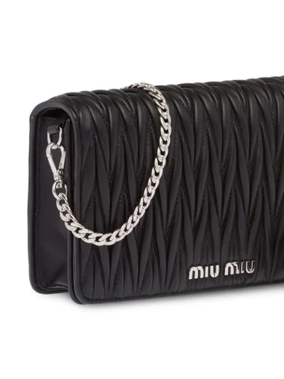 Shop Miu Miu Matelassé Logo Cross-body Bag In Black