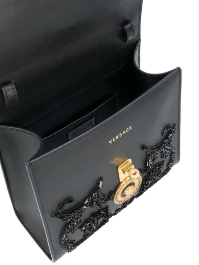 Shop Versace Embellished Medusa Shoulder Bag In Black