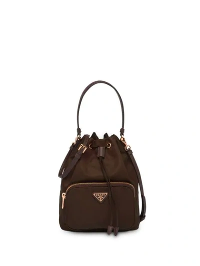 Shop Prada Logo Plaque Bucket Bag In Brown