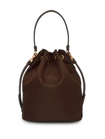 Shop Prada Logo Plaque Bucket Bag In Brown
