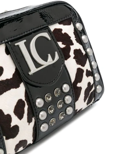 Shop La Carrie Cow Print Crossbody Bag In Black