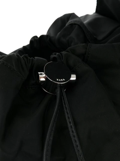 Shop Kara Drawstring Shoulder Bag In Black