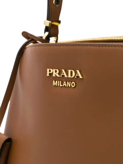 Shop Prada Top Handle Leather Tote In Brown