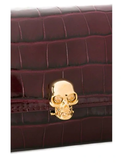 Shop Alexander Mcqueen Skull Leather Clutch In Red
