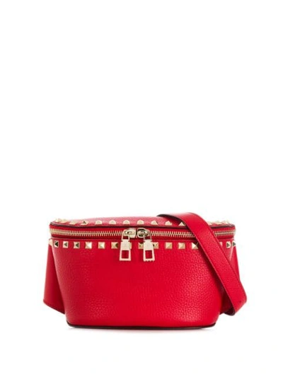Shop Valentino Rockstud Grainy Belt Bag In Red
