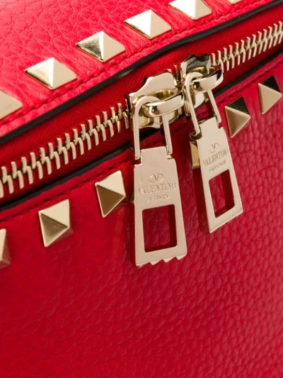 Shop Valentino Rockstud Grainy Belt Bag In Red