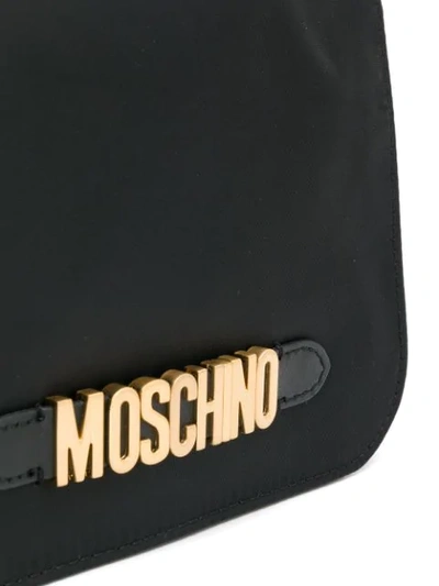 Shop Moschino Logo Plaque Crossbody Bag In Black