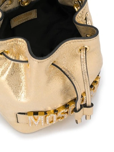 Shop Moschino Metallic Crystal-embellished Bucket Bag In Gold