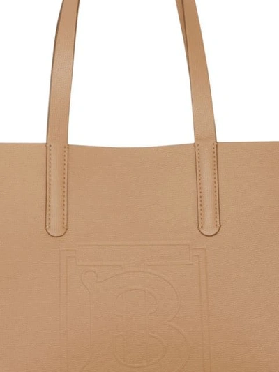 Shop Burberry Embossed Monogram Motif Leather Tote In Neutrals