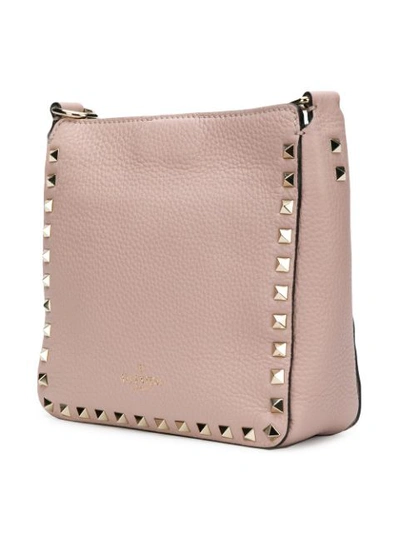 Shop Valentino Garavani Rockstud Messenger Bag In Neutrals