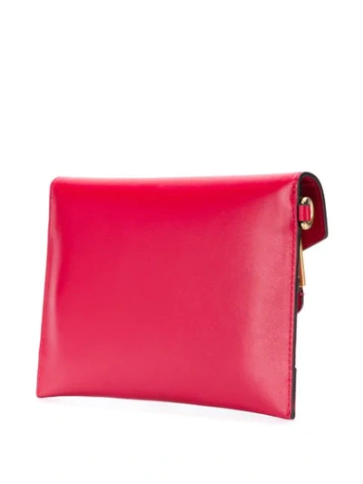 Shop Moschino Logo Print Clutch Bag In Red