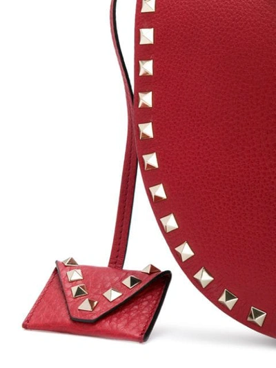 Shop Valentino Garavani Rockstud Saddle Shoulder Bag - Red