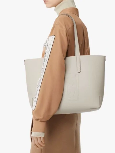 Shop Burberry Embossed Monogram Motif Leather Tote In Neutrals