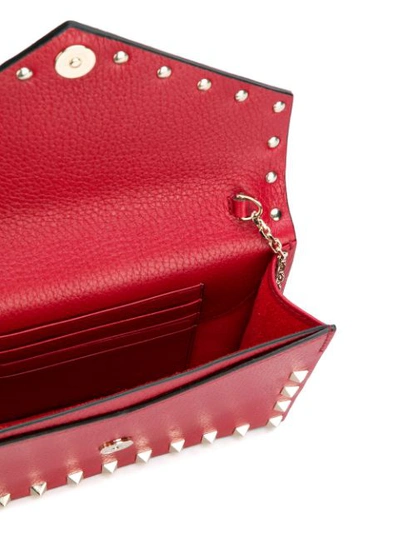 Shop Valentino Garavani Envelope Rockstud Clutch Bag In Red