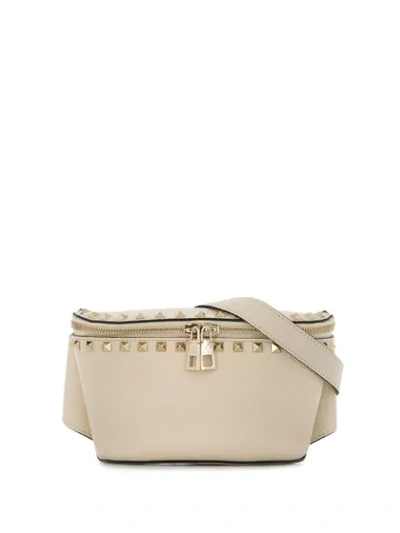 Shop Valentino Garavani Rockstud Belt Bag In Neutrals