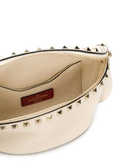 Shop Valentino Garavani Rockstud Belt Bag In Neutrals