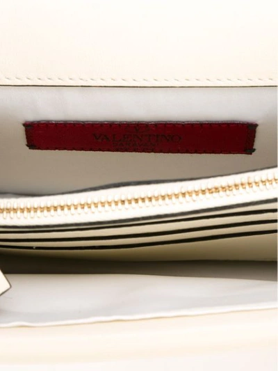 Shop Valentino Rockstud Clutch Bag In White
