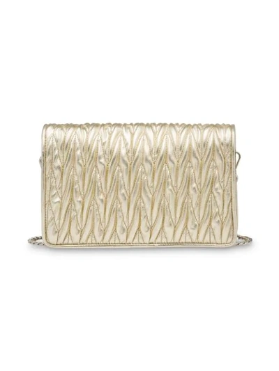 Shop Miu Miu Matelassé Logo Cross-body Bag - Neutrals