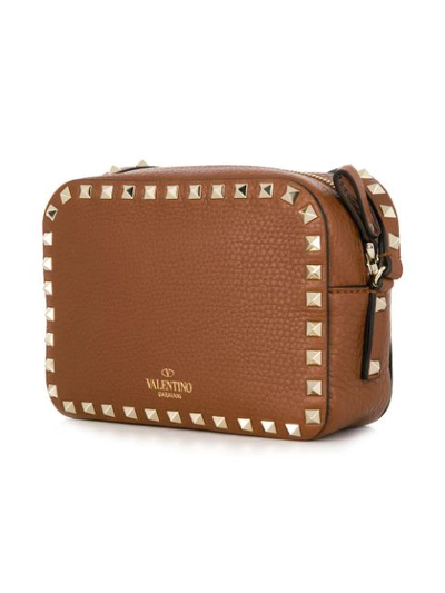 Shop Valentino Garavani Rockstud Crossbody Bag In Brown