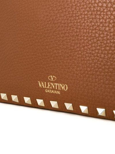 Shop Valentino Garavani Rockstud Crossbody Bag In Brown