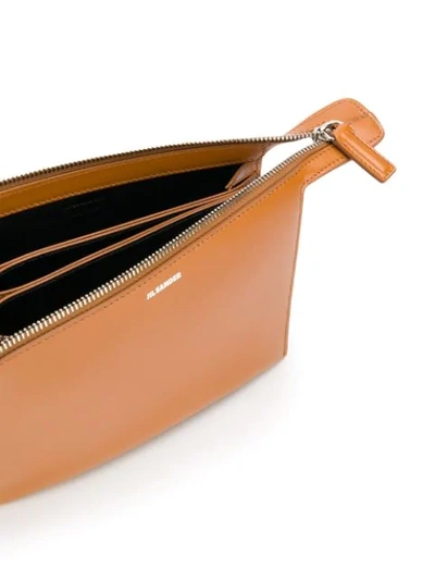 Shop Jil Sander Clutch Shoulder Bag In Brown