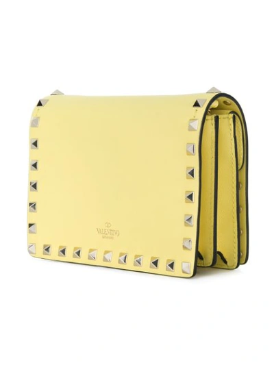 Shop Valentino Garavani Rockstud Crossbody Bag - Yellow