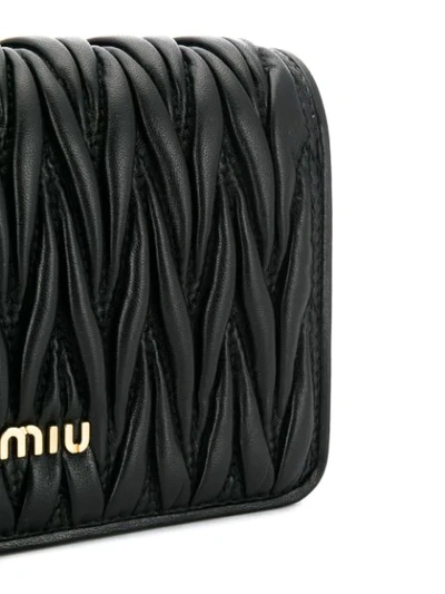 Shop Miu Miu Matelassé Embellished Shoulder Bag In Black