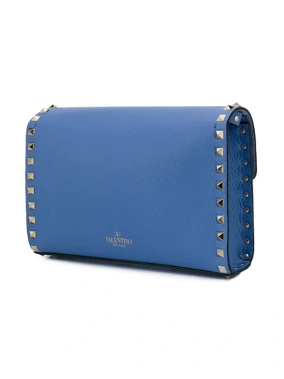 Shop Valentino Garavani Small Rockstud Crossbody Bag In Blue