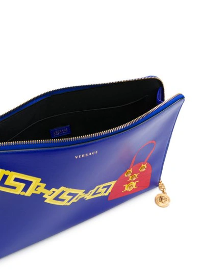 Shop Versace Handbag Print Clutch - Blue