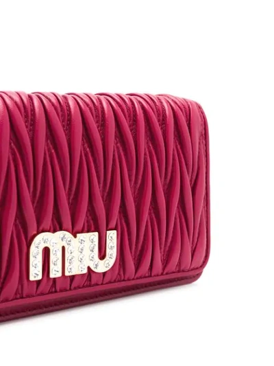 Shop Miu Miu Crystal Embellished Matelassé Clutch In F0041 Rubino