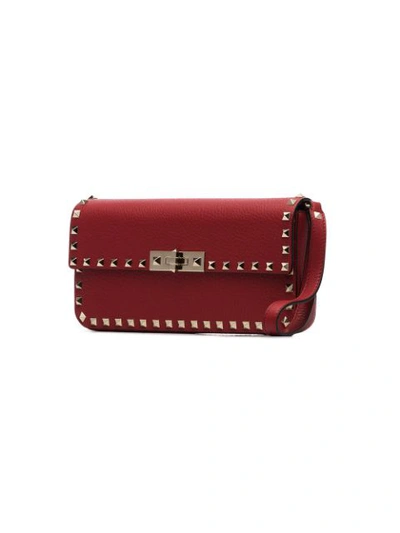 Shop Valentino Rockstud Leather Clutch In Red