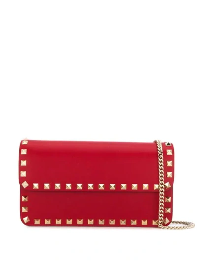 Shop Valentino Rockstud Clutch In Red