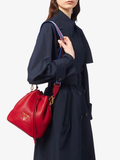 Shop Prada Drawstring Bucket Bag In Red