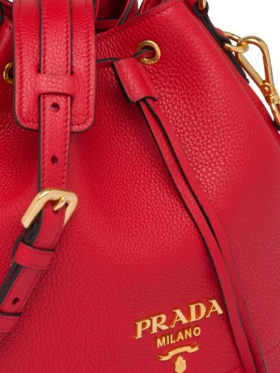 Shop Prada Drawstring Bucket Bag In Red