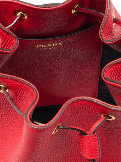 Shop Prada Drawstring Bucket Bag In Red