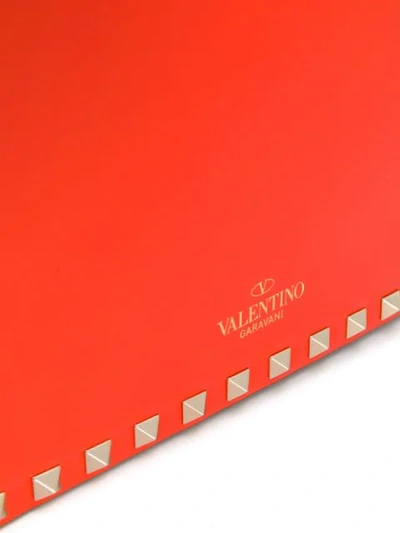 Shop Valentino Garavani Rockstud Shoulder Bag In Orange