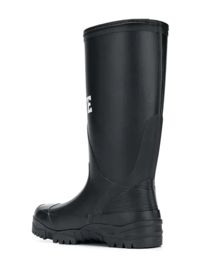 Shop Undercover Slogan Waterproof Boots In Black