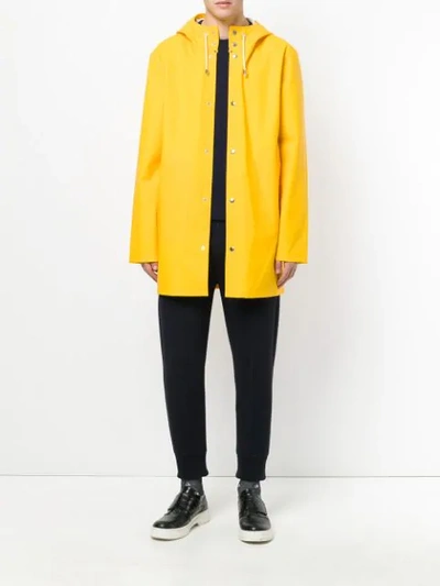 Shop Stutterheim Hooded Raincoat - Yellow