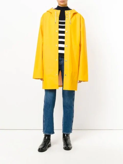 Shop Stutterheim Hooded Raincoat - Yellow