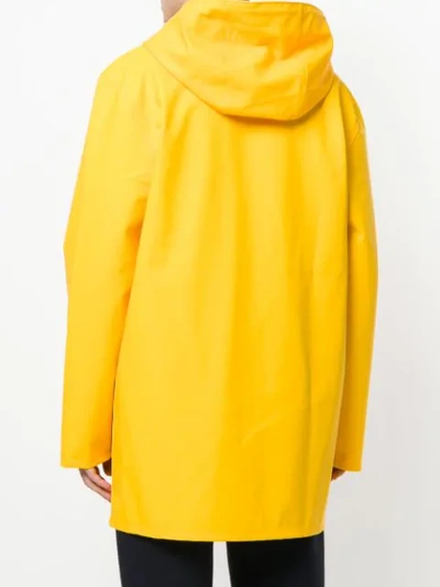 Shop Stutterheim Hooded Raincoat - Yellow