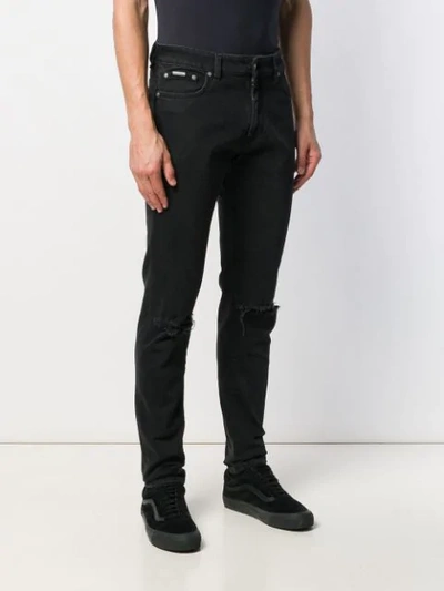 Shop Represent Distressed Denim Jeans In Black